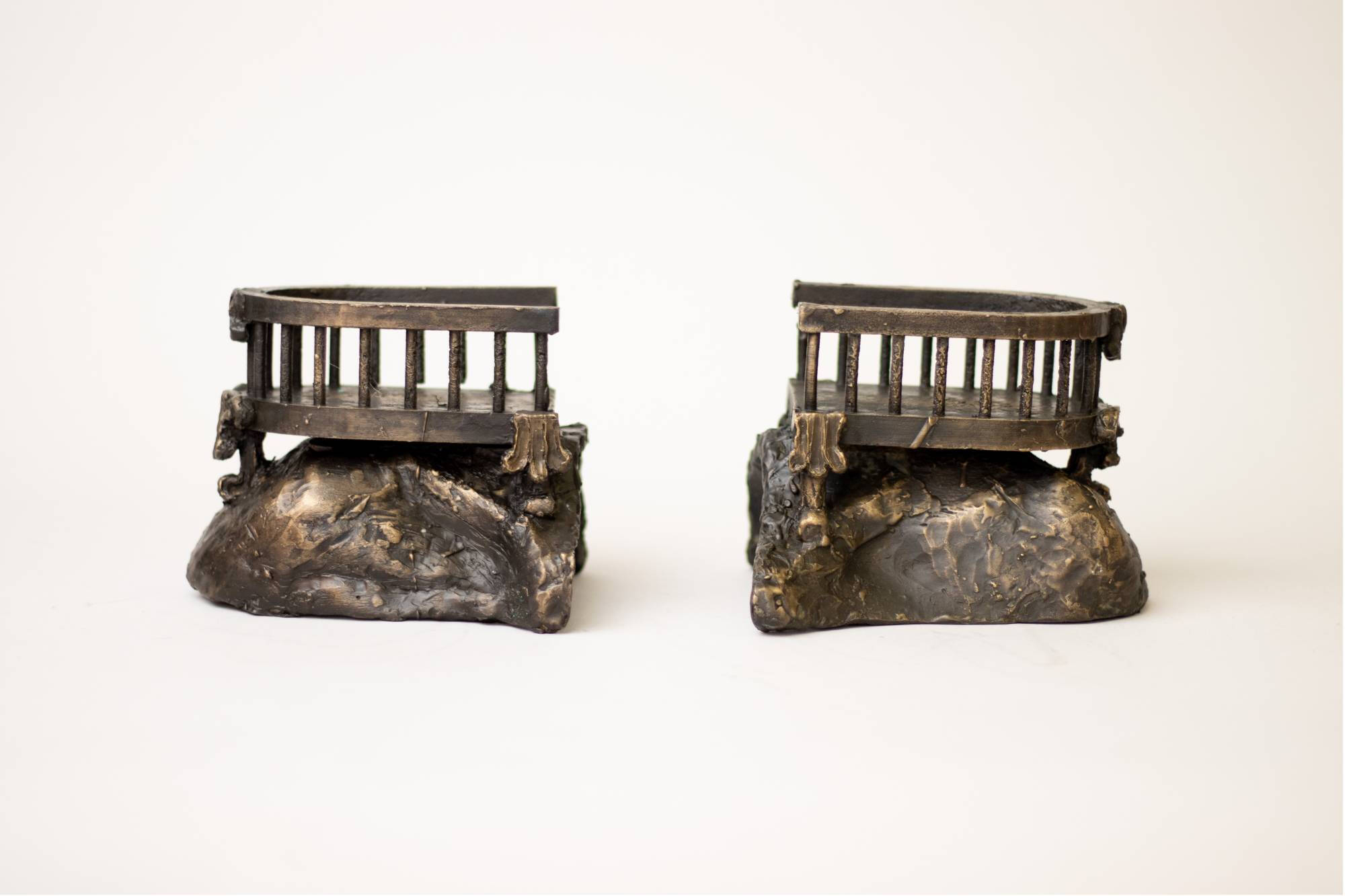 Two bronze bookends.